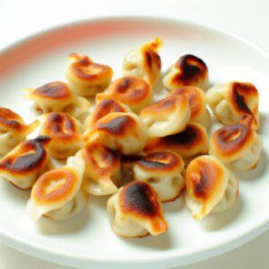 Golden pan-fried Kürdü dumplings filled with spiced minced meat and vegetables