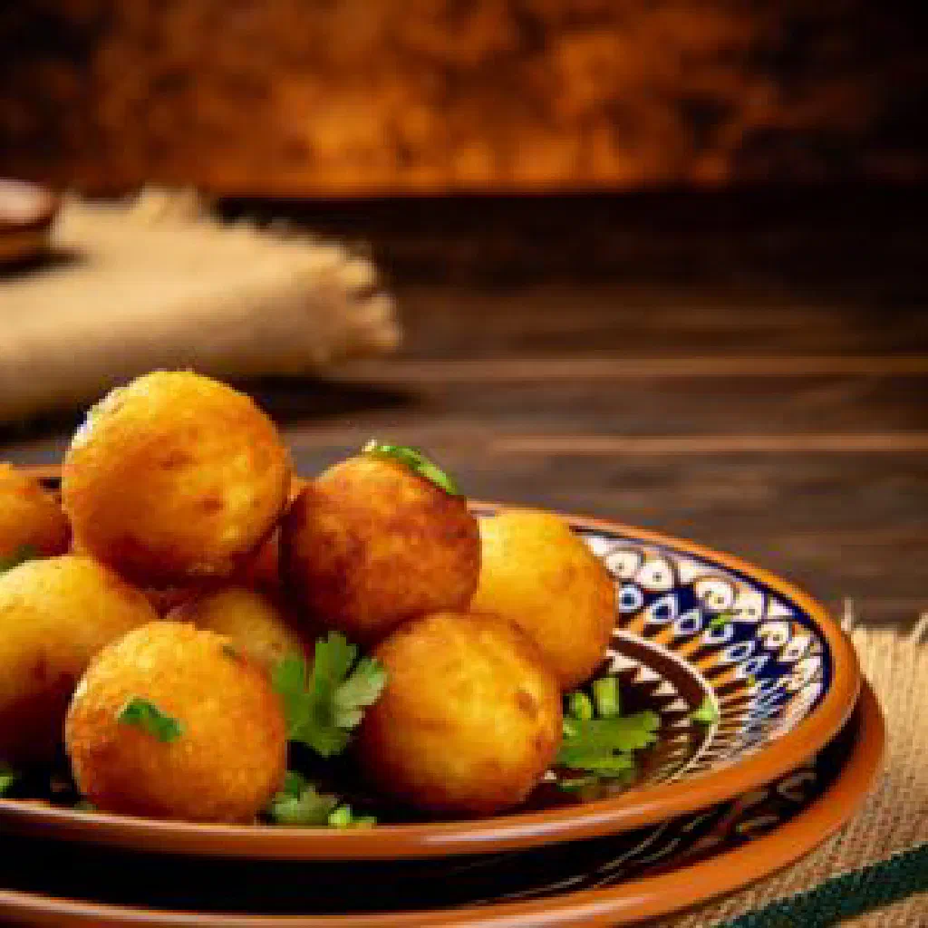 Sweet Bahraini khabees made from semolina and dates, dusted with spices