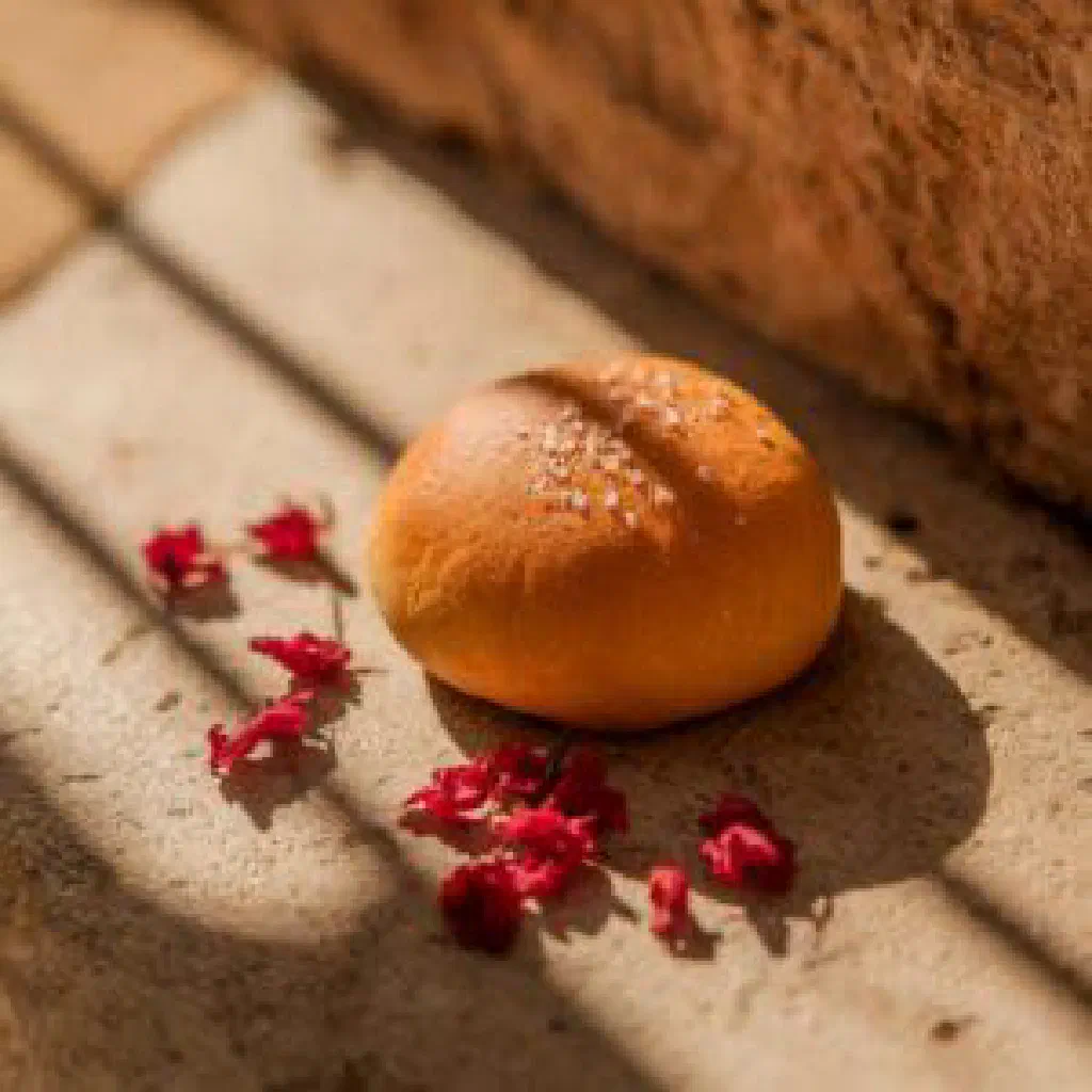 Golden-brown fried bakes piled on a plate