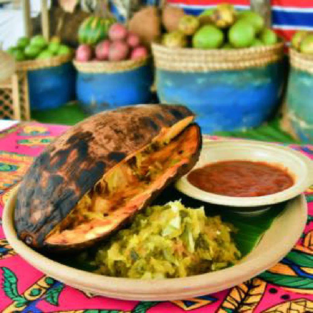 Roasted breadfruit with charred skin and tender starchy flesh