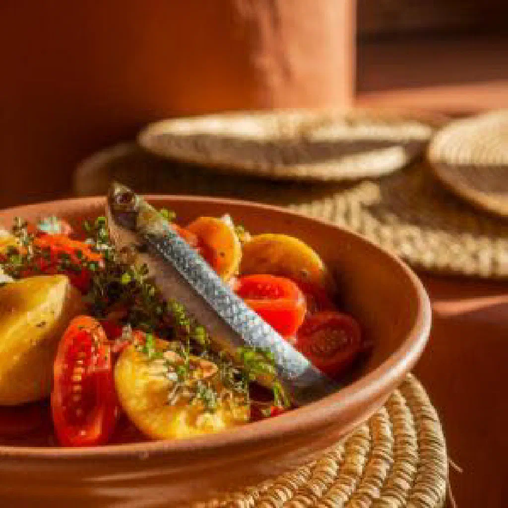 Steamed yam pieces served with a spiced vegetable sauce