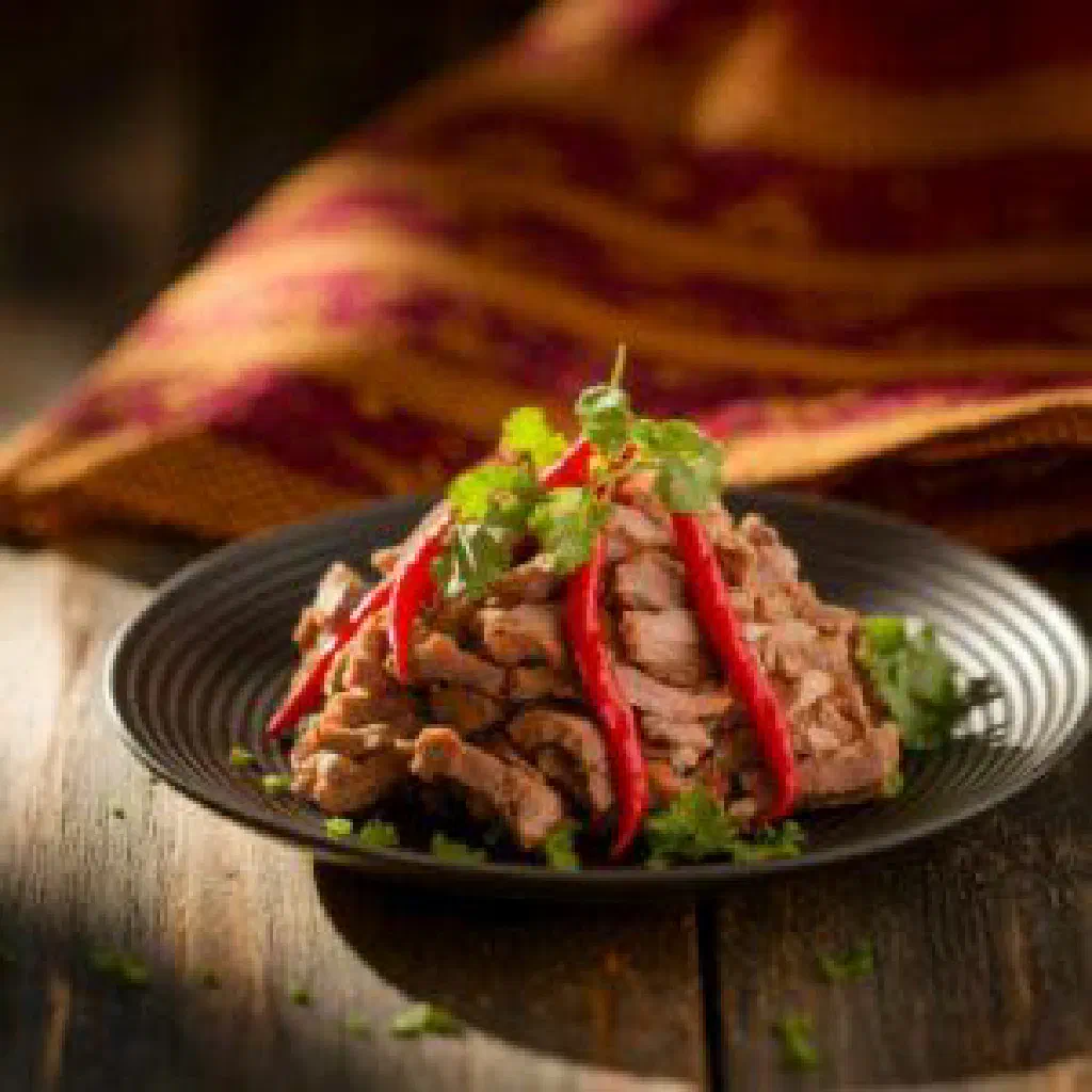 Bowl of Goen Hogay with rice, meat, peppers and fresh coriander