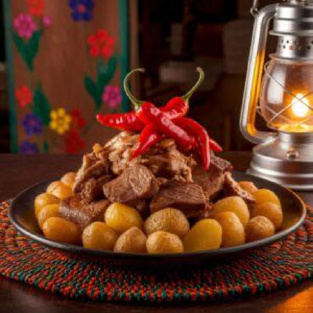 A bowl of Jayacucho, an Andean quinoa dish with peppers and fresh coriander