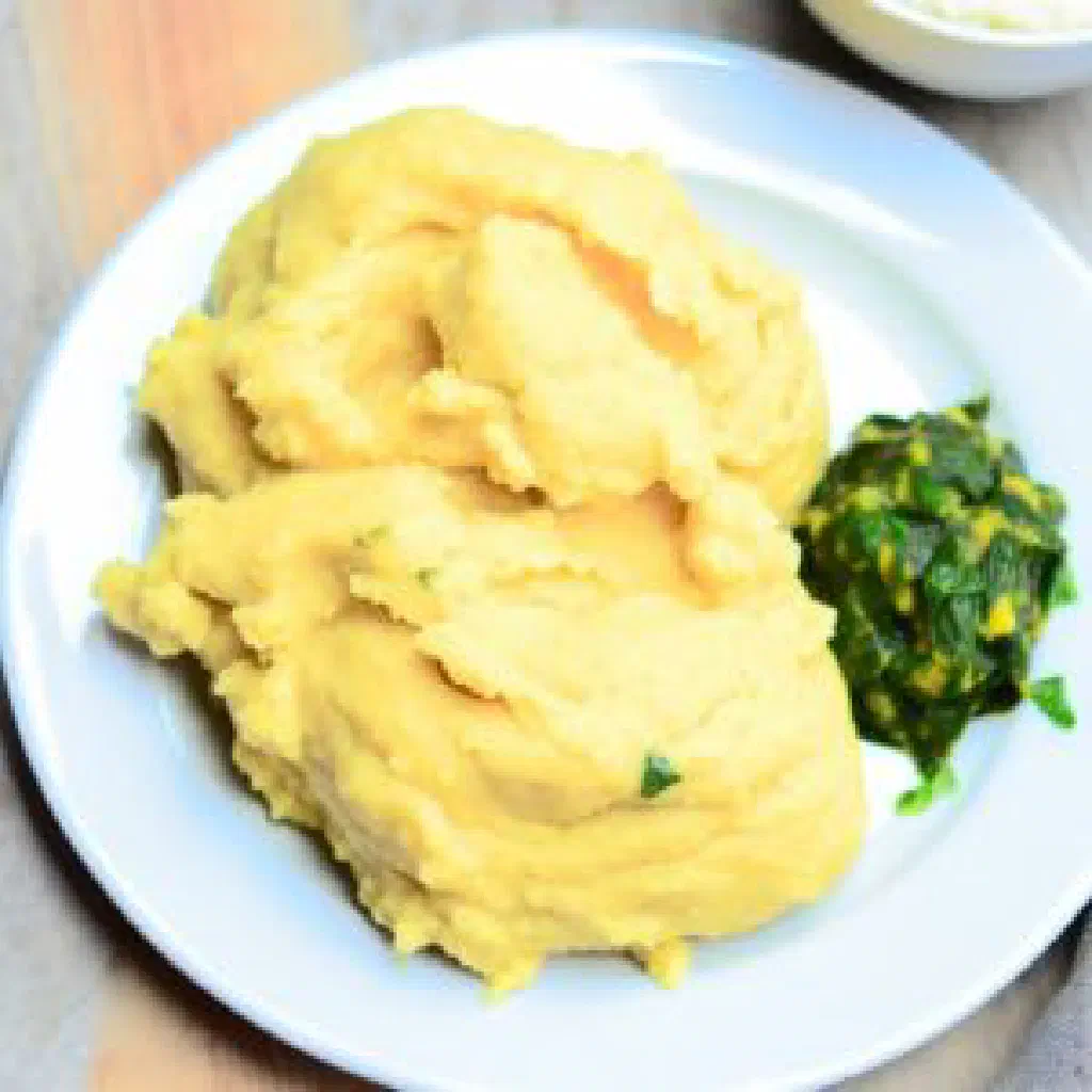 A firm block of bugali maize-meal porridge served on a plate