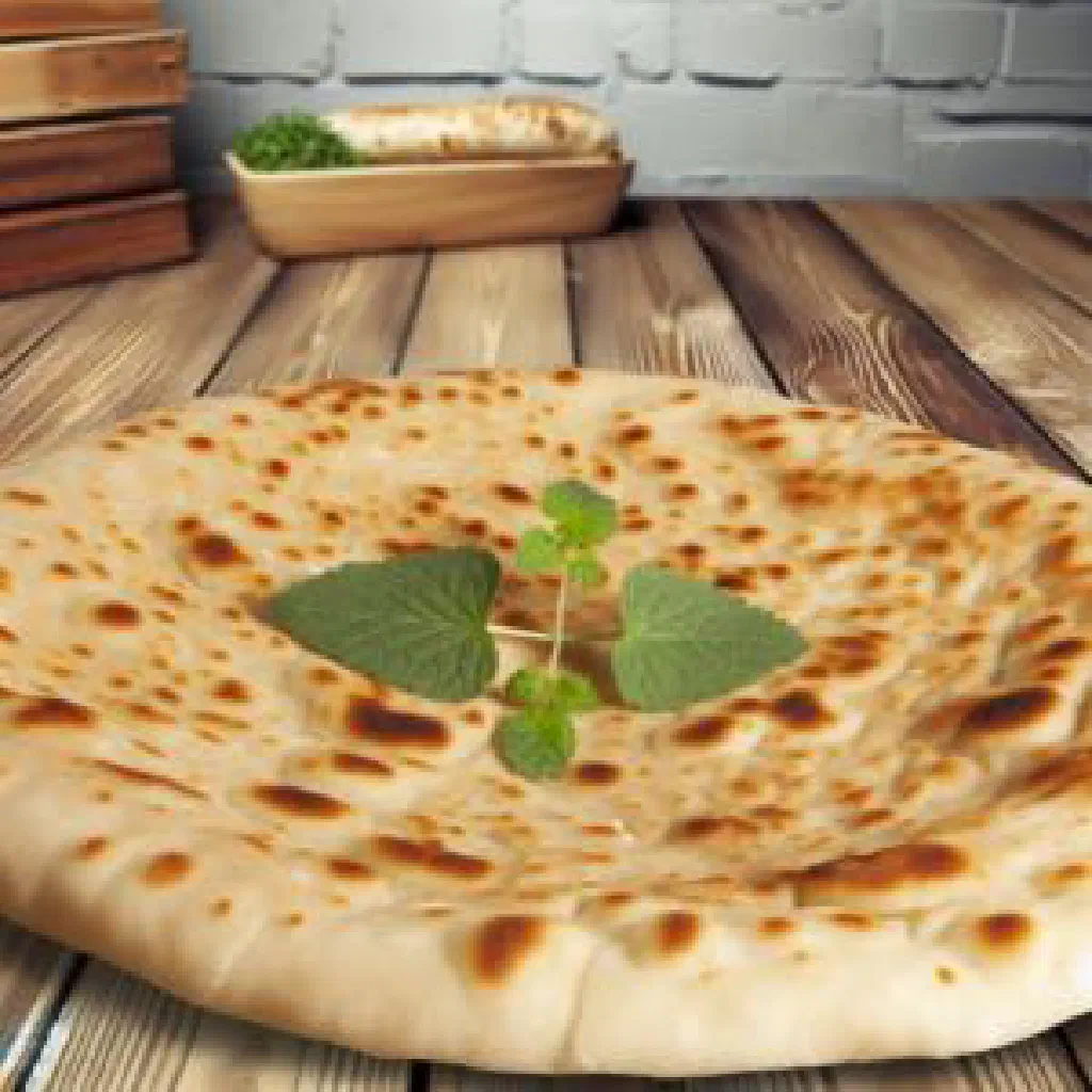 Golden pan-fried bannique flatbread cut into wedges