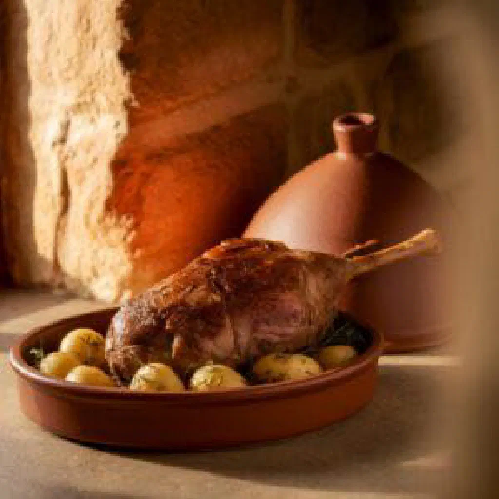 Slow-cooked lamb with potatoes and herbs from under the peka bell