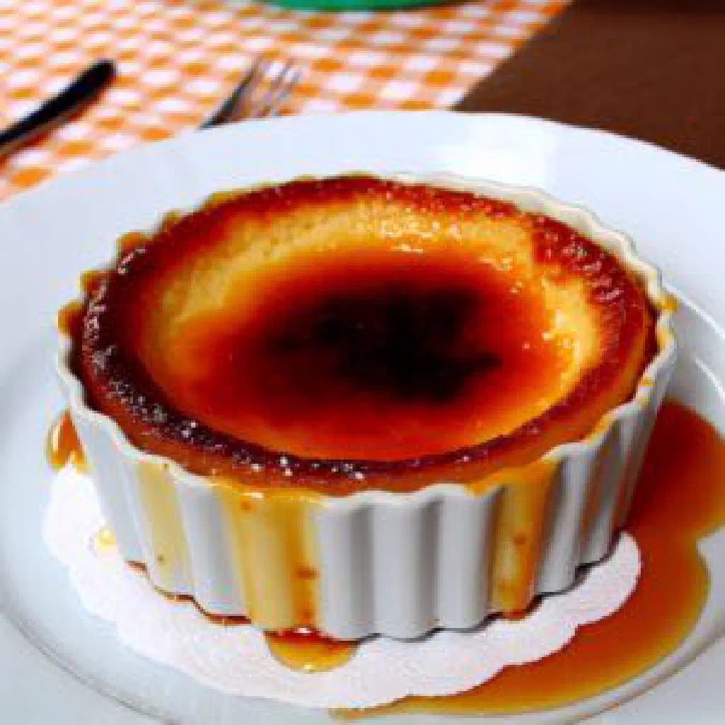 Rozata custard turned out onto a plate with caramel topping