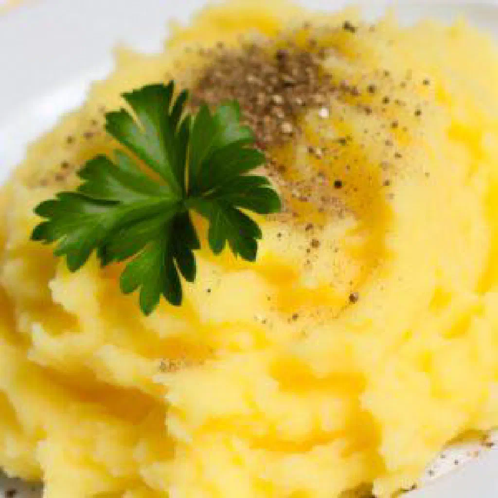 Creamy mashed malanga topped with fresh parsley