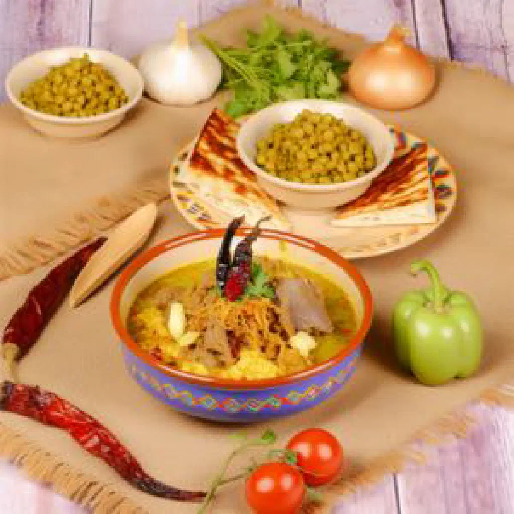 Slow-cooked lamb kawaree in a rich broth, garnished with fresh parsley