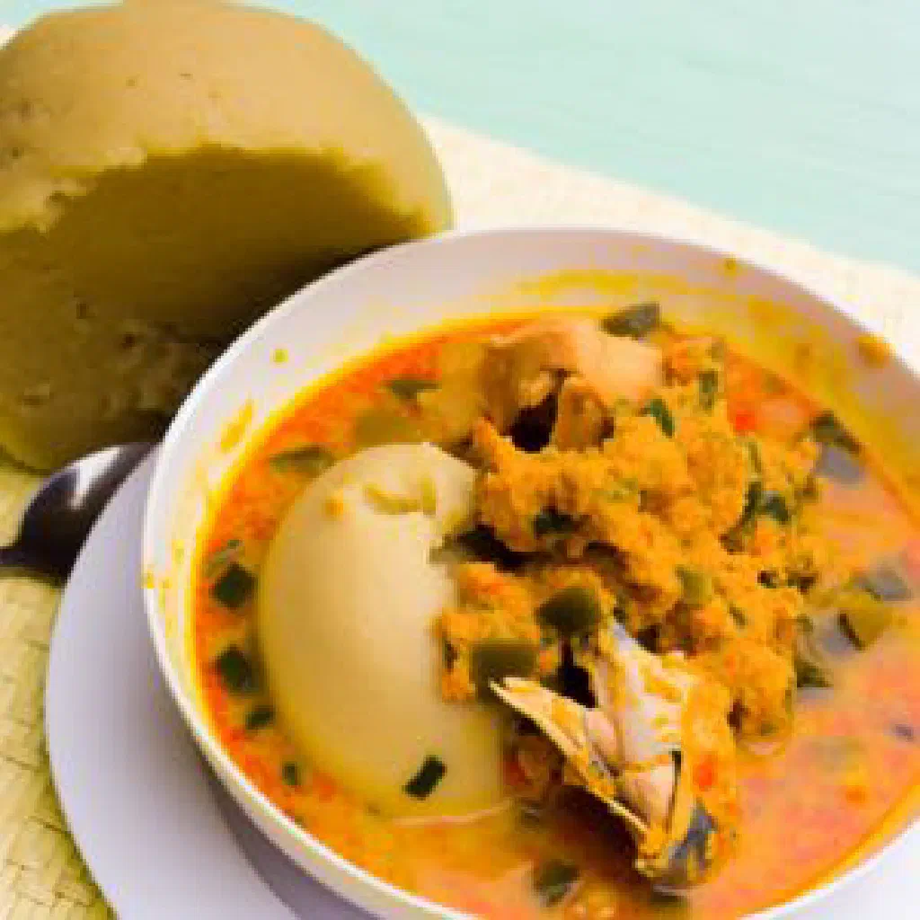 Kokó Esá chicken in a rich peanut sauce garnished with fresh herbs