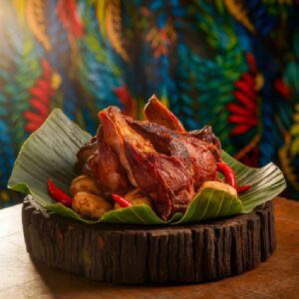 Baked Fijian banana dessert in coconut milk served in a small bowl