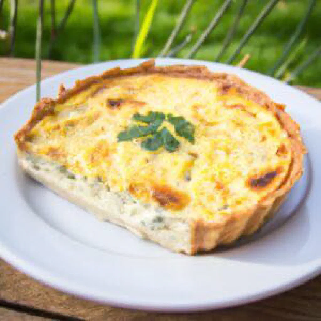 Golden quiche Lorraine with a crisp pastry base and creamy bacon filling