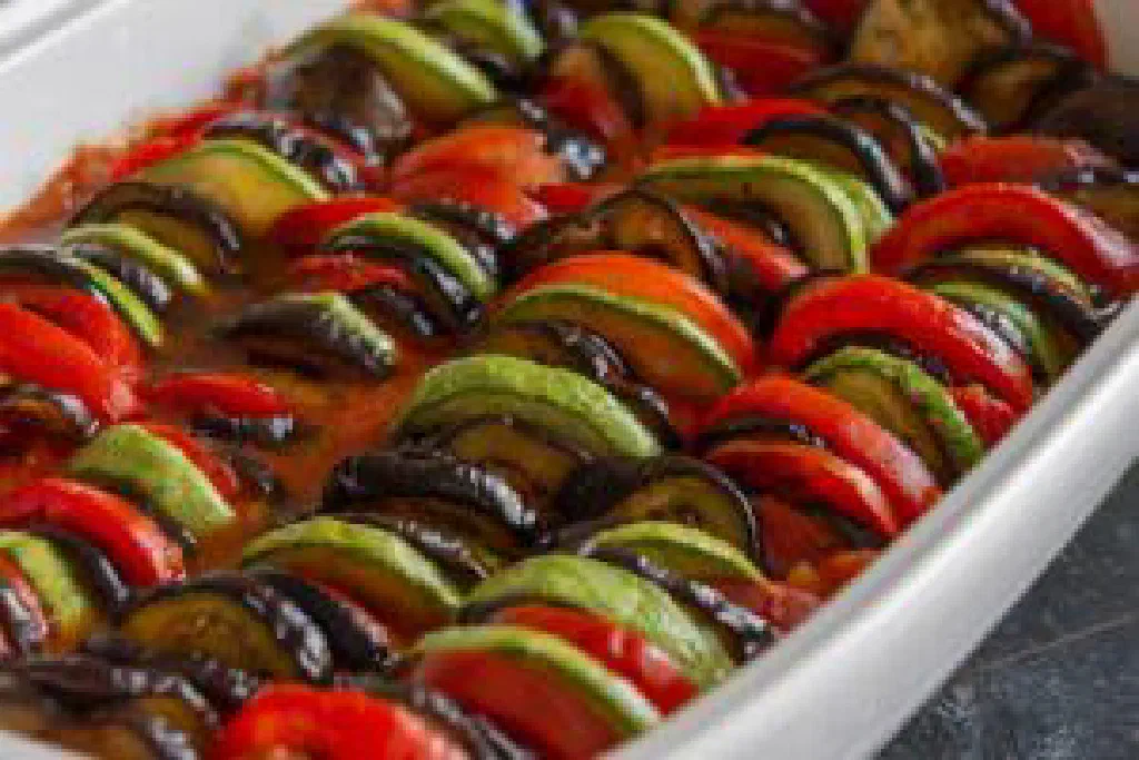 A colourful bowl of ratatouille with diced aubergine, courgette and peppers