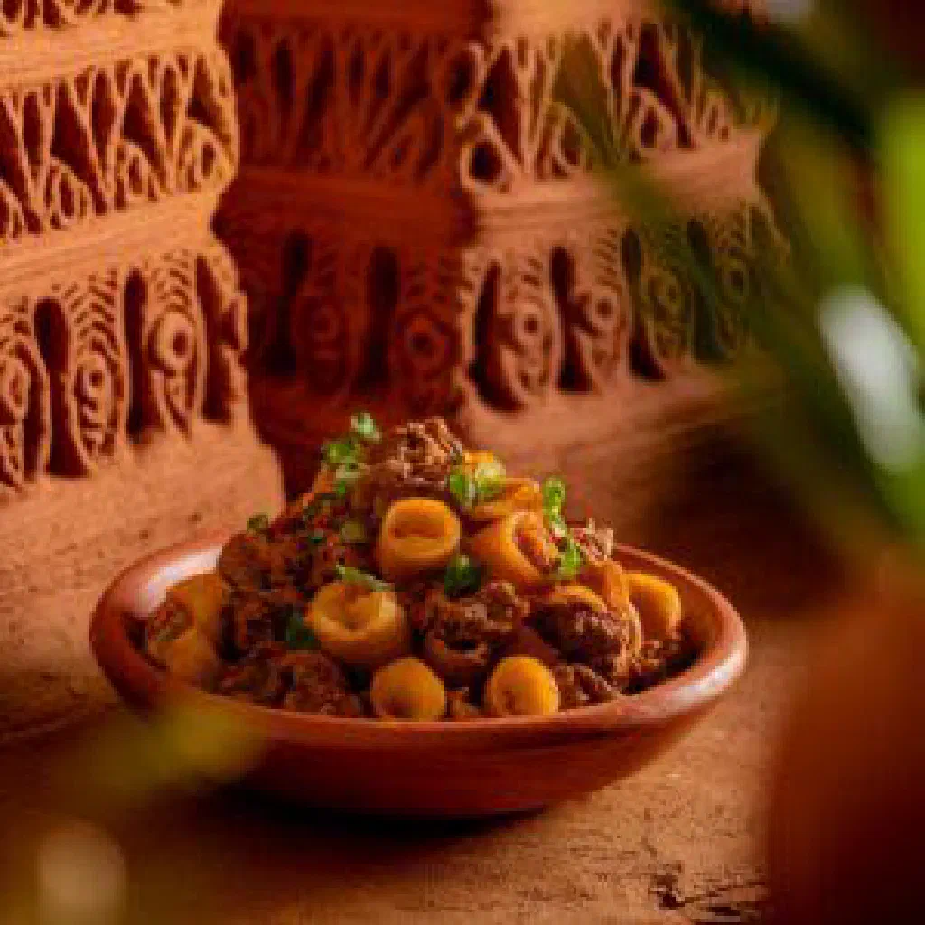 Nyambeh Nyebbeh with chicken, mango and fresh coriander