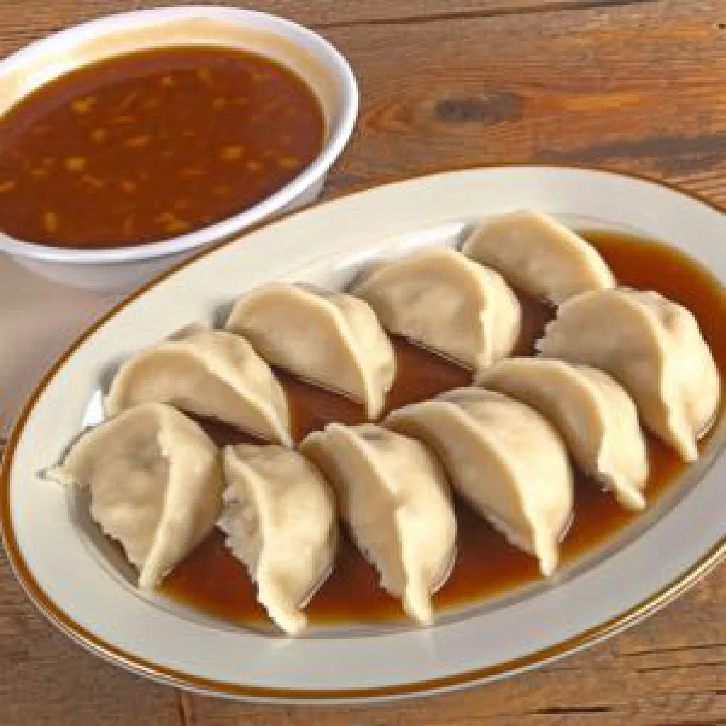 Sliced Bohemian dumplings served with rich gravy