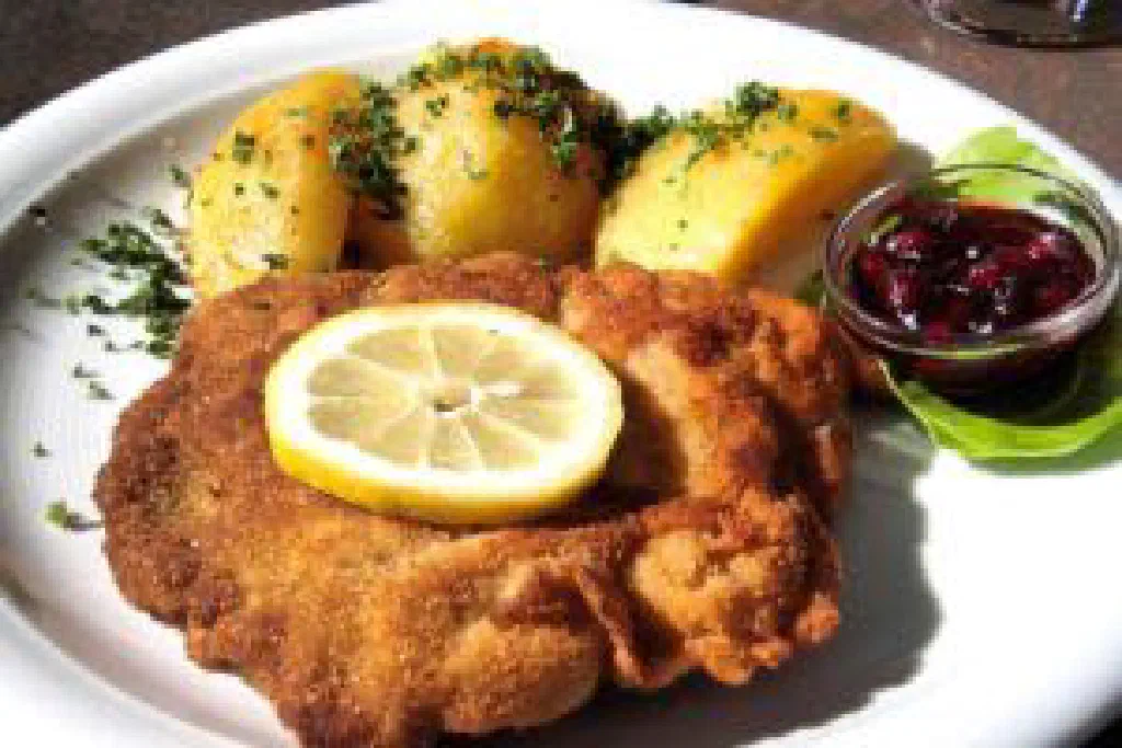 Golden breaded schnitzel served with a slice of lemon