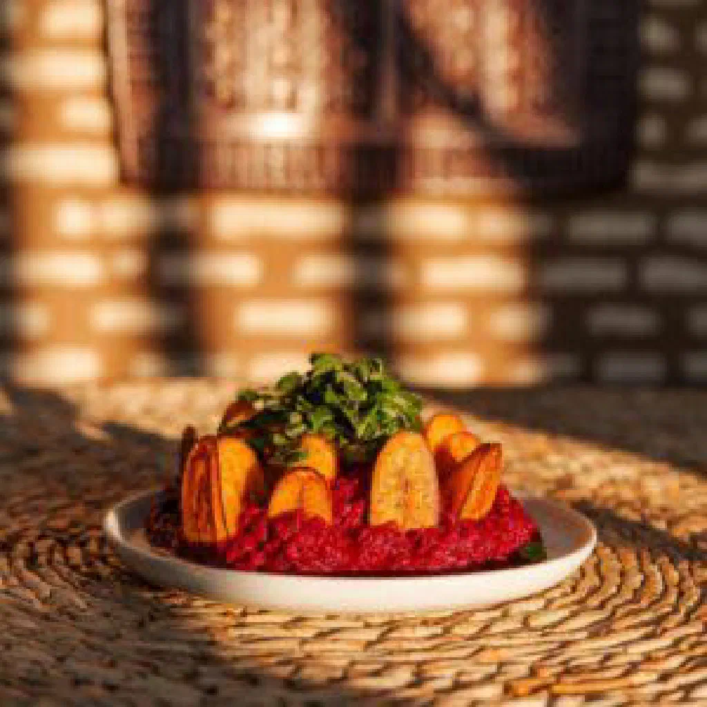 Bowl of spiced Ghanaian Zowey rice with peppers and tomatoes