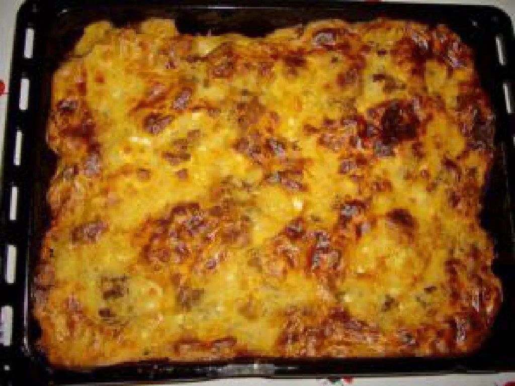 Baked Greek moussaka with layers of aubergine, minced meat and golden cheese