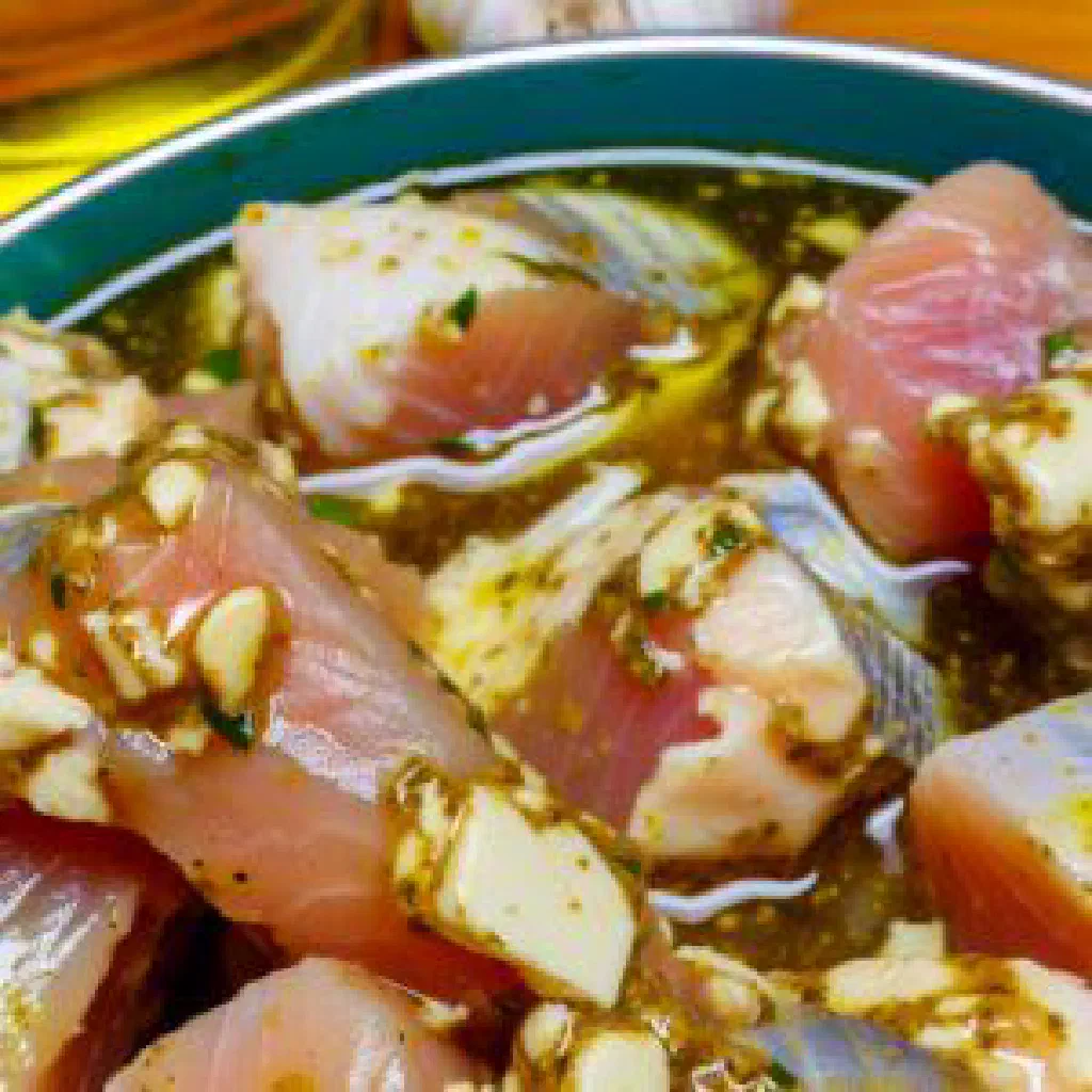 Kaldur fiskur with fermented fish, onions and fresh dill on a plate