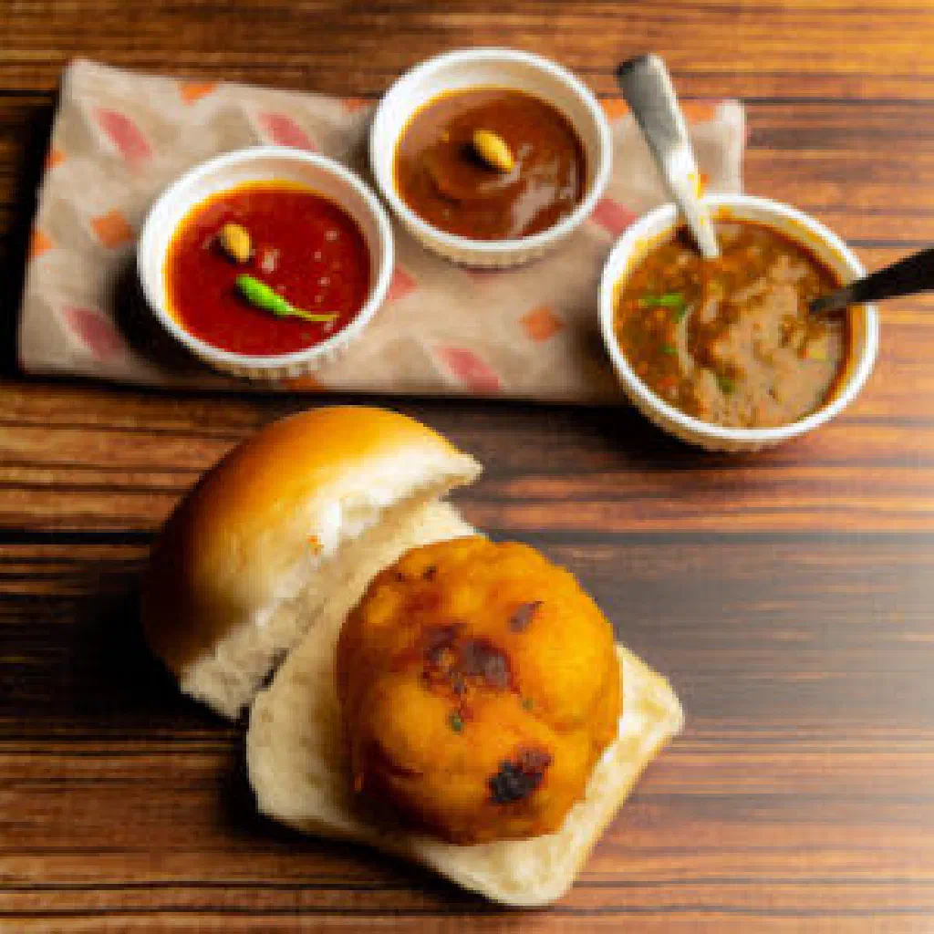 Vada Pav with a spiced potato fritter tucked into a soft bread roll