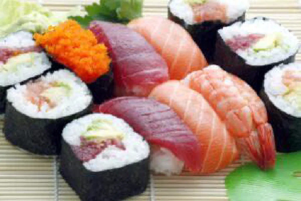 Freshly rolled sushi slices topped with salmon and tuna