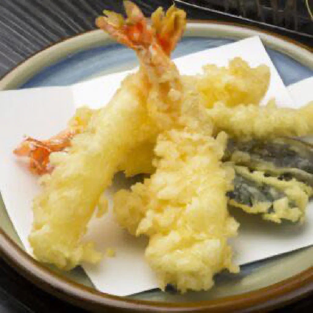 Golden, crisp tempura of fish and vegetables on a plate