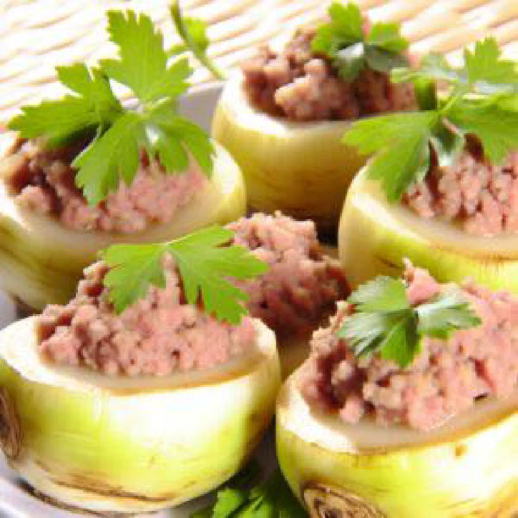 Stuffed turnips filled with minced meat and rice, garnished with fresh herbs