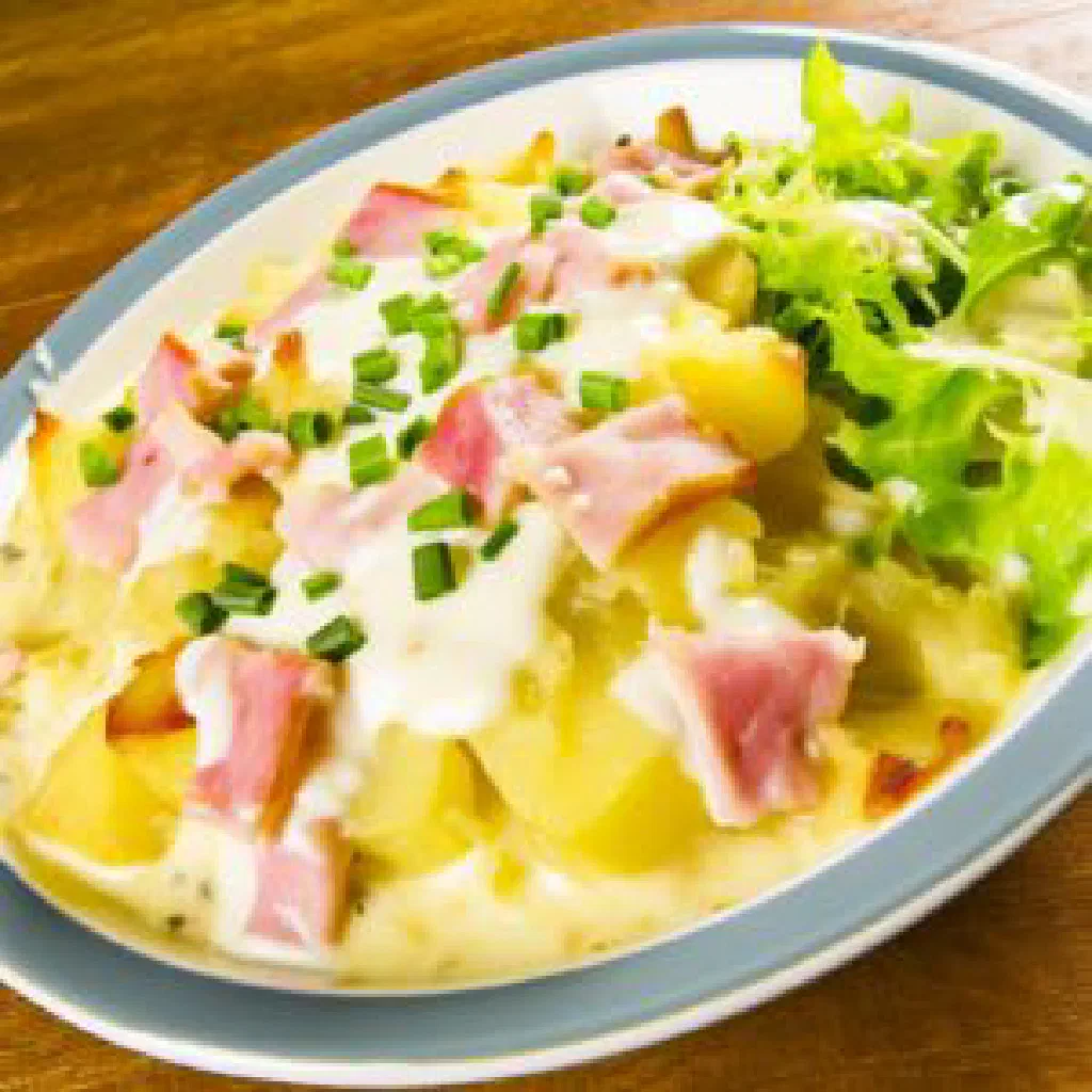 Golden-baked Luxembourgish potato gratin with a browned cheese crust