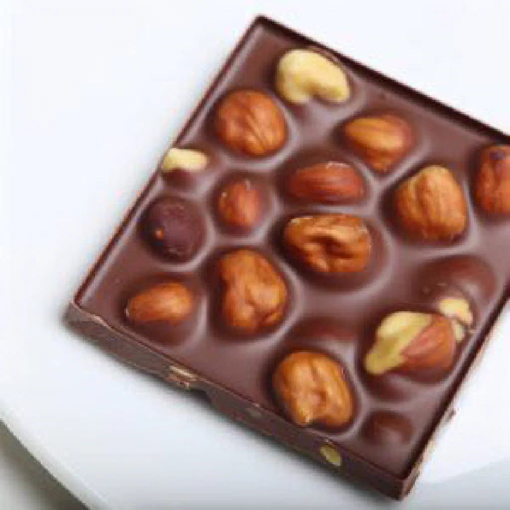 Pieces of Luxembourgish Schockela chocolate studded with nuts and dried fruit
