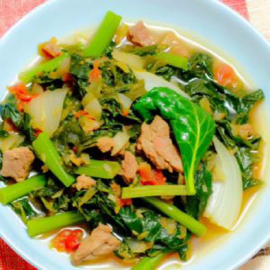 Varanga with tender meat simmered in spiced coconut milk, garnished with fresh coriander