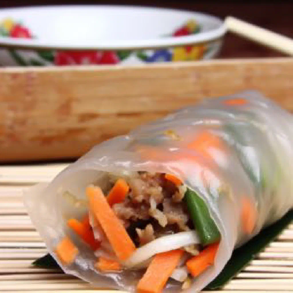 Fresh popiah basah spring rolls filled with vegetables, tofu and herbs