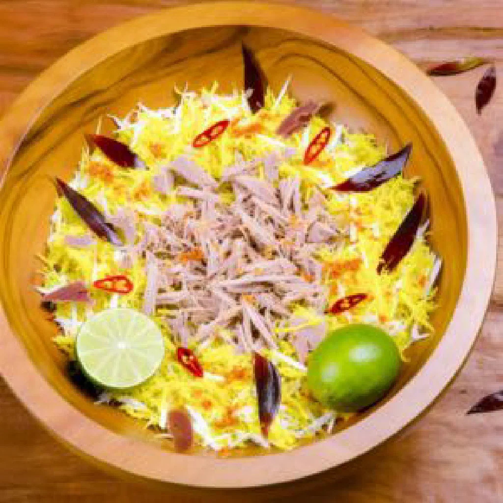 Bowl of fathu mashuni with shredded tuna, grated coconut and fresh coriander