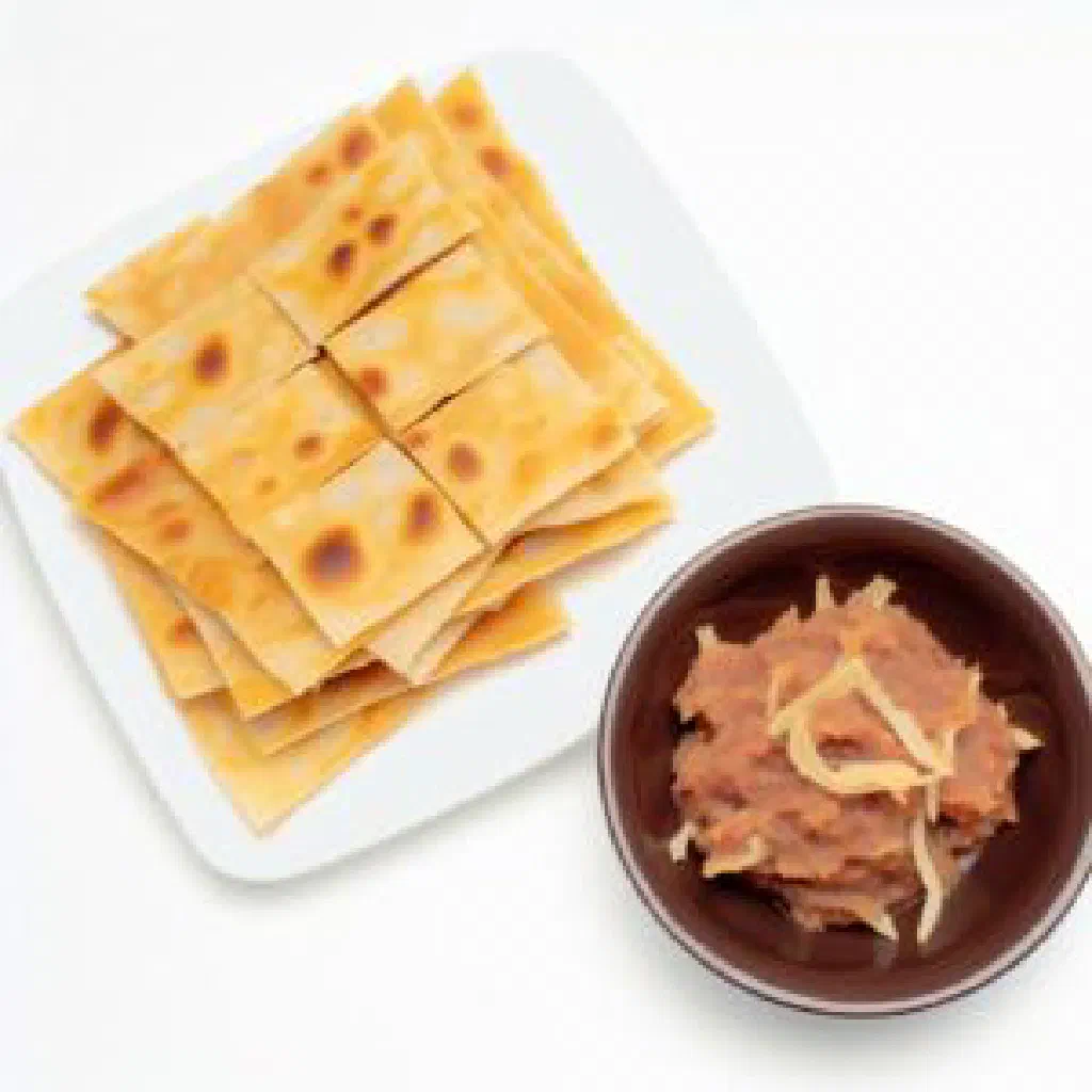 Fithiroshi flatbread topped with spiced tuna, onion and herbs