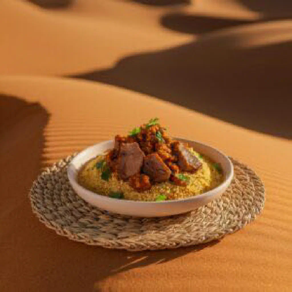 Bowl of golden Mauritanian tamina drizzled with honey