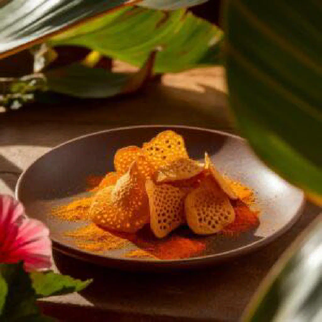Golden, crispy wada lentil fritters served with fresh coriander