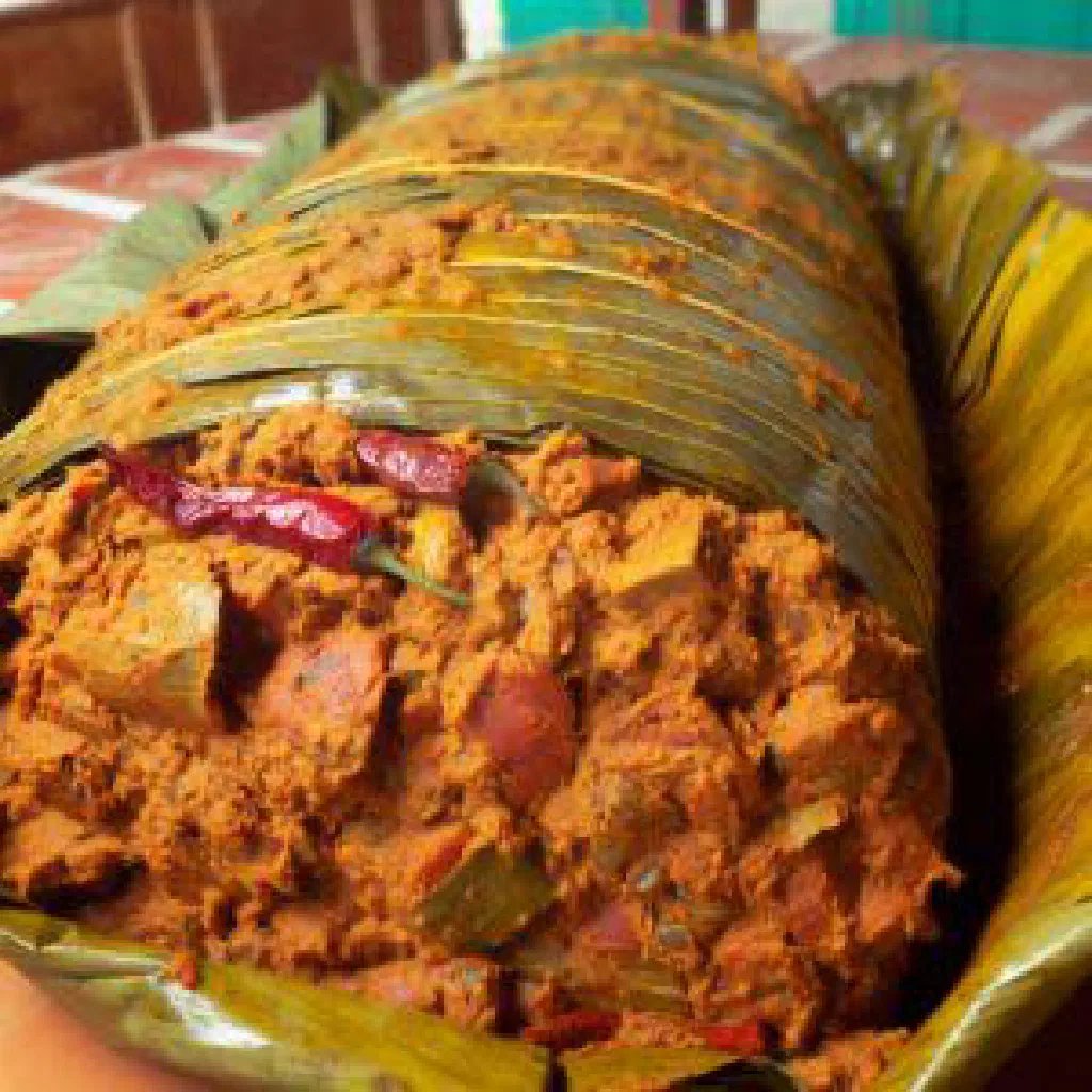 Zacahuil tamale wrapped in banana leaves with spiced pork filling