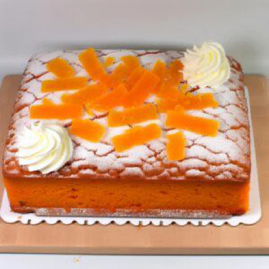 Slices of bright orange Dutch Oranjekoek cake with a marmalade filling