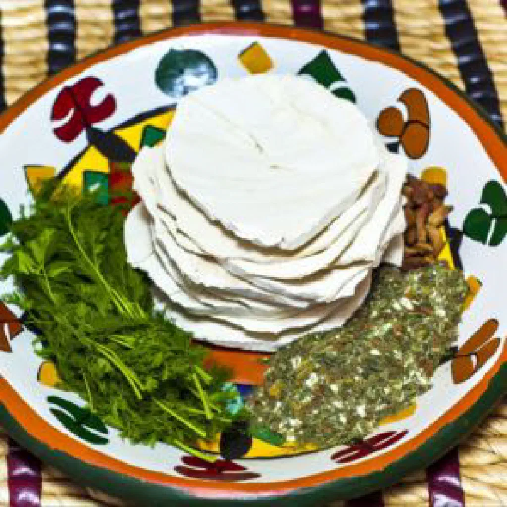 Golden pan-fried wara patties garnished with fresh herbs