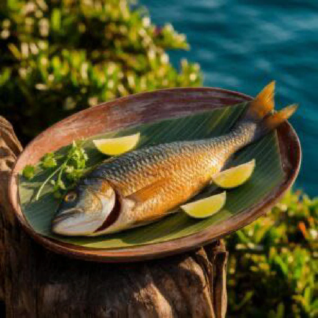 Grilled fish fillets with lime and ginger marinade, garnished with fresh herbs