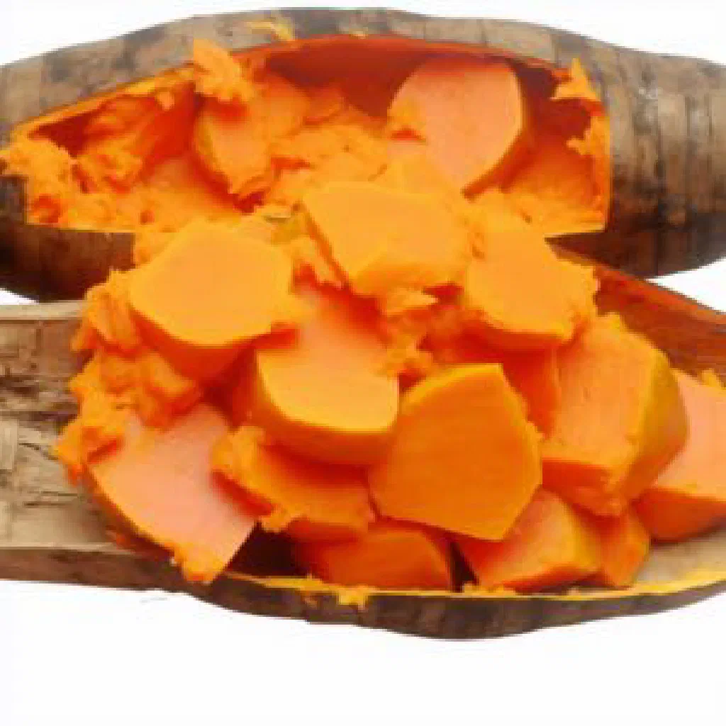 Golden sweet potato cubes in a bowl garnished with fresh herbs