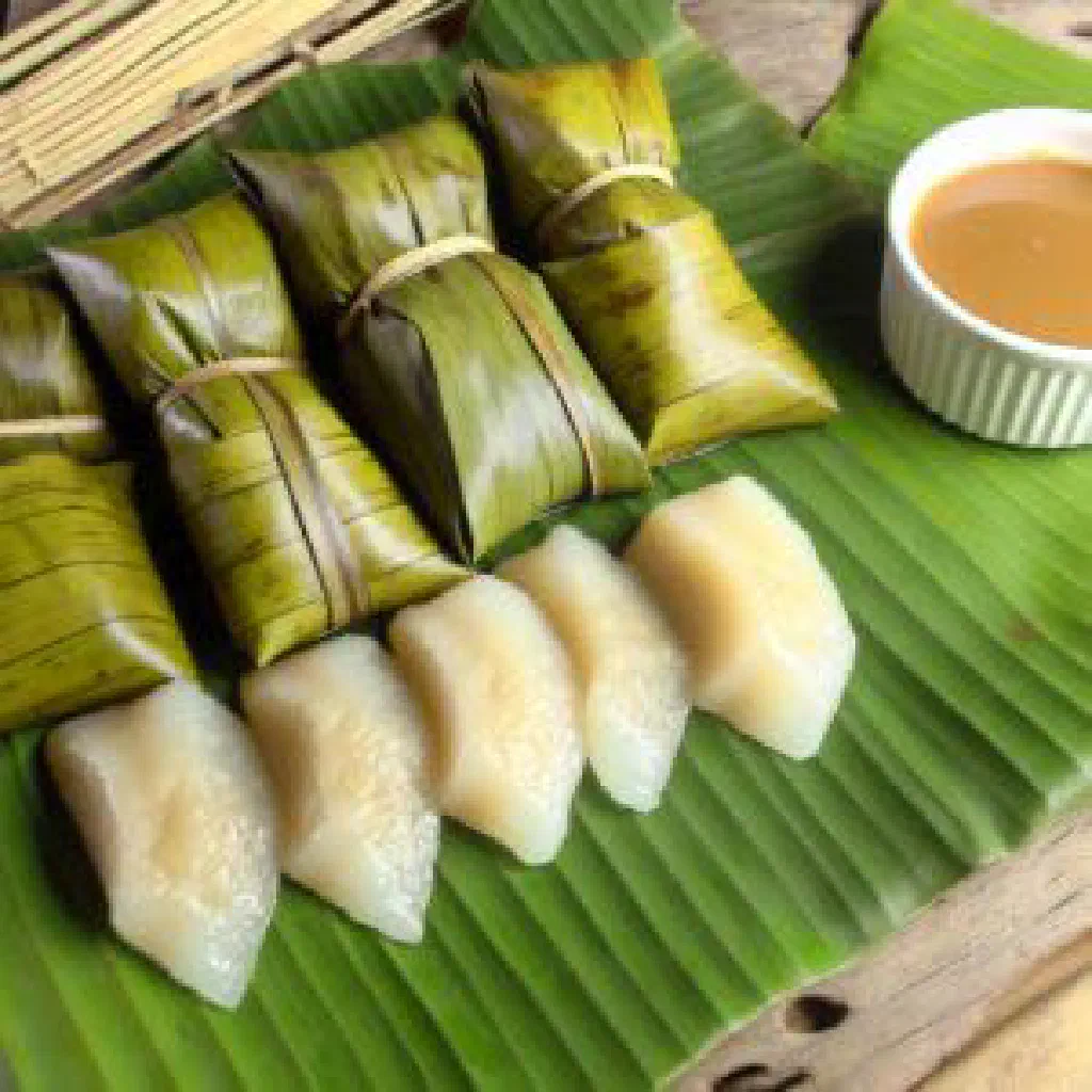 Suman sticky rice cakes wrapped in banana leaves
