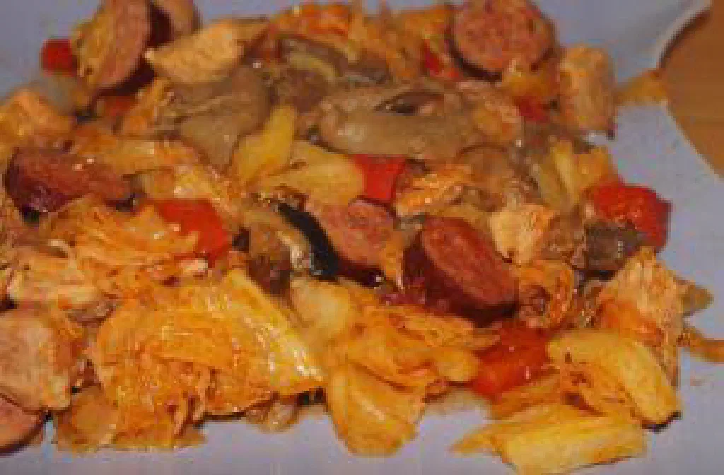 A bowl of bigos with sauerkraut and braised meat