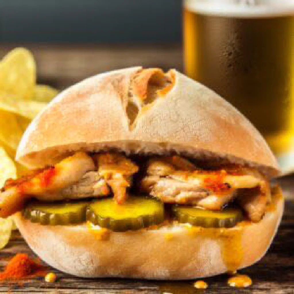 Bifanas pork sandwich in a crusty bread roll with mustard