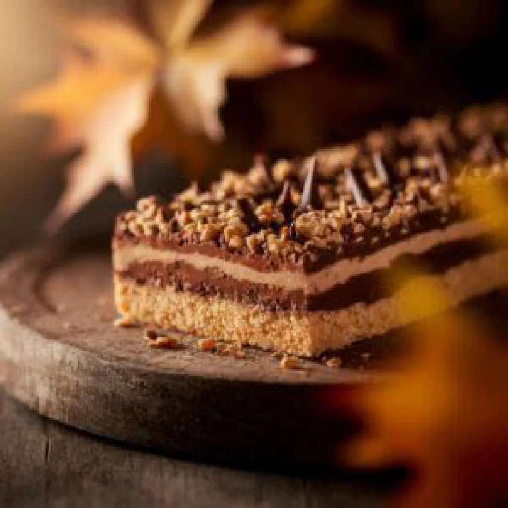 Mounded Muraveynik anthill cake of crushed biscuits dusted with cocoa