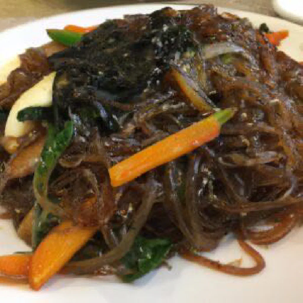 Japchae glass noodles stir-fried with colourful vegetables and sesame seeds