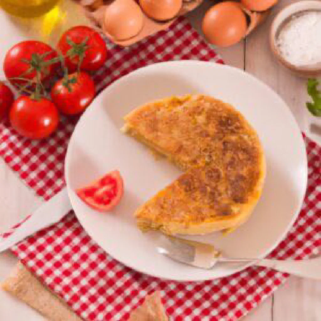 Golden Spanish potato and onion omelette cut into wedges
