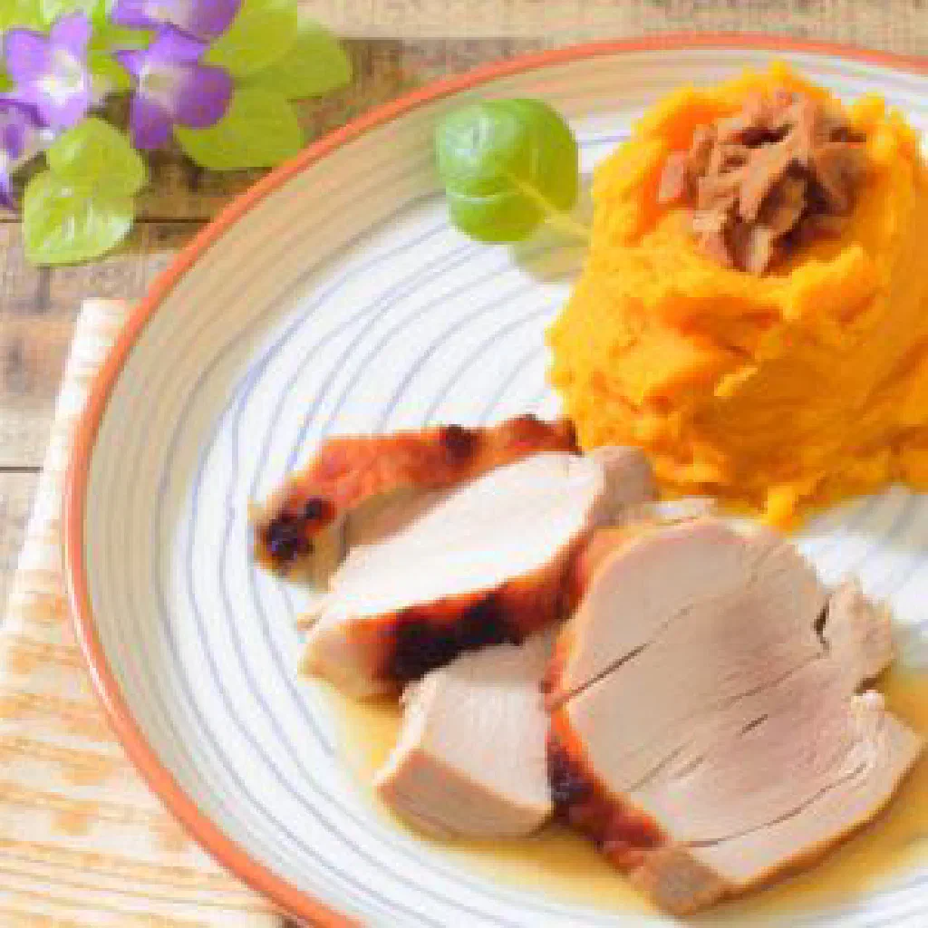 Pickled pork souse served with sliced sweet potato pudding on a plate