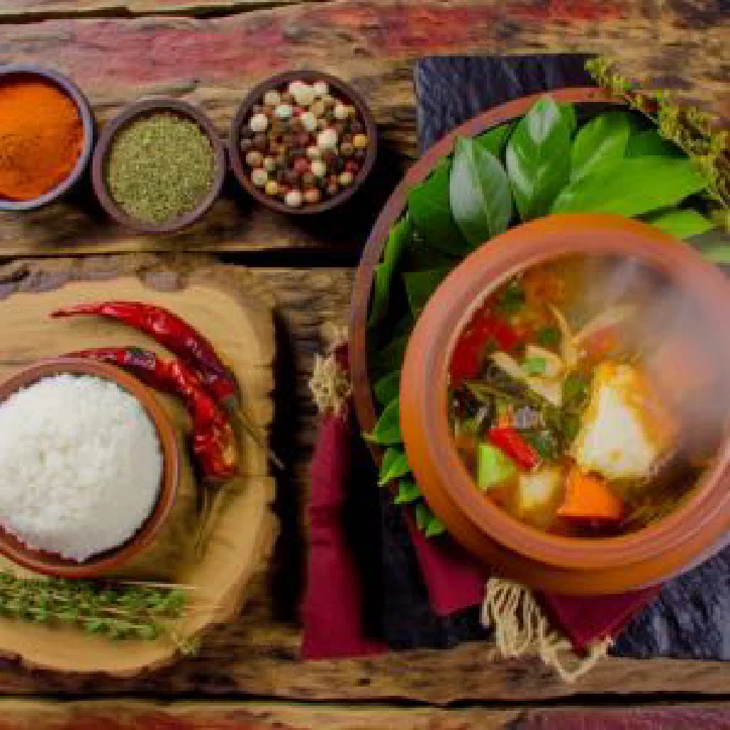Bowl of Surinamese Kwasi Bita Soep with tender beef, carrots and green beans