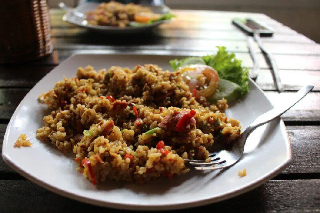Golden Surinamese nasi with chicken, peas and fresh coriander