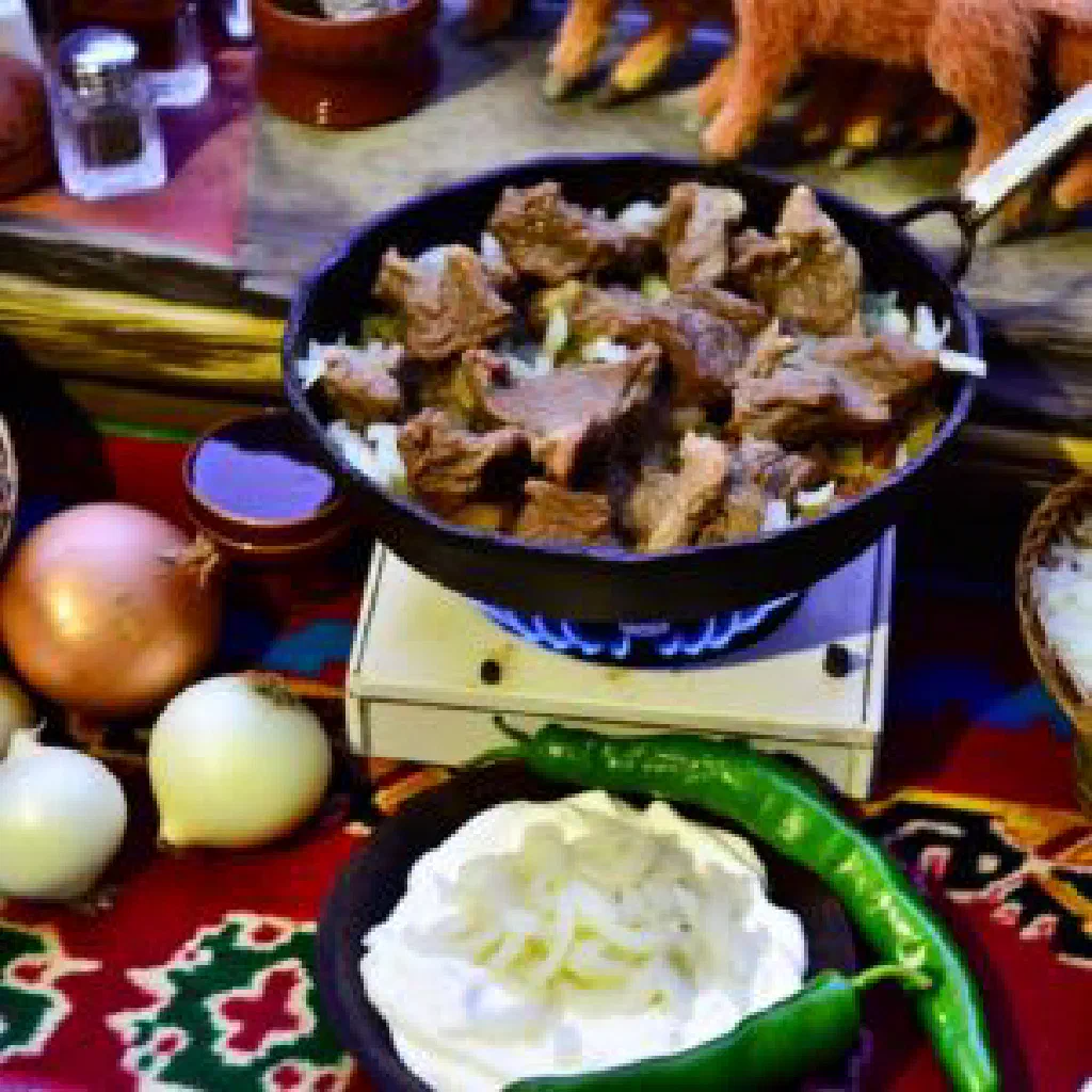 Jiz-biz — tender spiced lamb with onions, garnished with fresh herbs